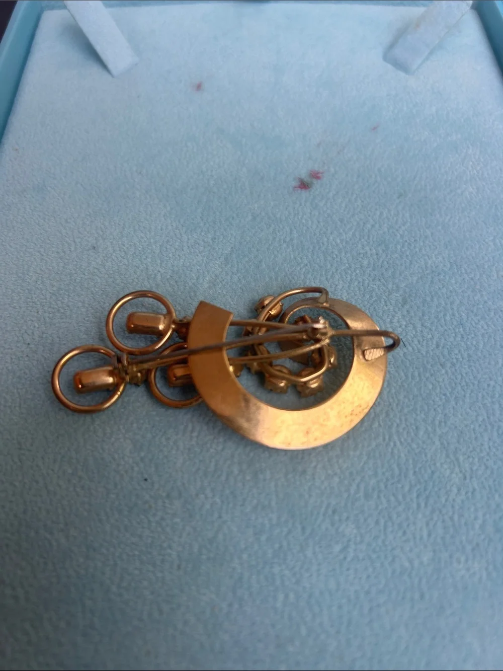 Vintage gold tone brooch with pink and clear rhinestones